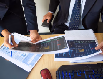 investor-trader-discussing-statistic-data-holding-papers-with-financial-charts-pen-cropped-shot-broker-job-trading-concept_74855-14252