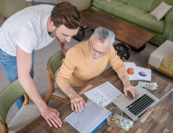 teamwork-two-men-working-together-project-looking-involved_259150-52331
